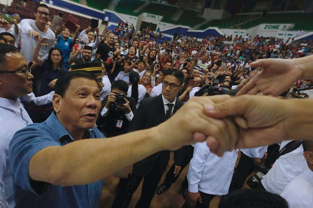 president rodrigo duterte greets his overseas filipino supporters at the indoor 336662 10247501442679085291854