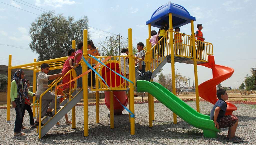 children play on their new playground following the 95c354 10241591653279471689697