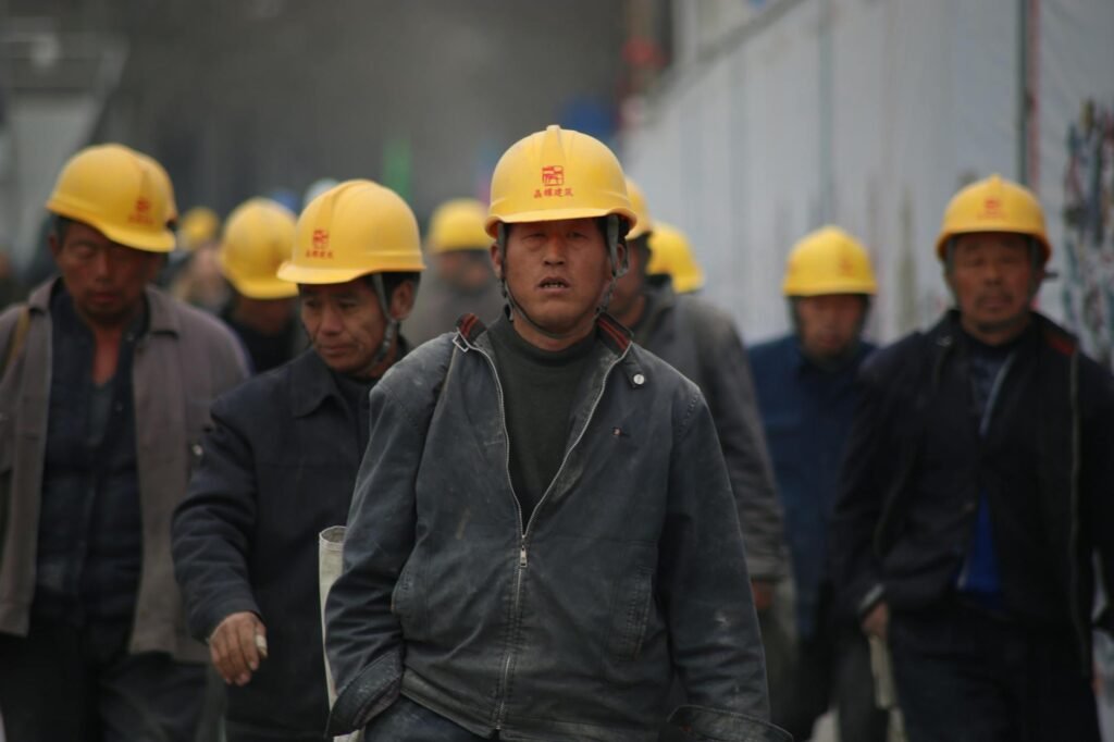 Honoring Workers' Sacrifices: A Global Call for Safer Workplaces 1 work chinese industrial professional