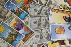 colorful tarot cards and us currency background