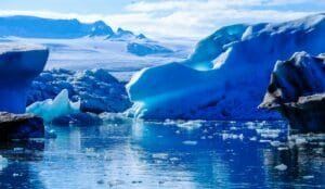 iceberg on body of water digital wallpaper