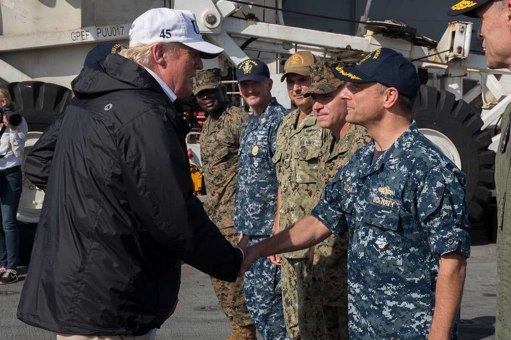 president donald trump shakes hands with capt david guluzian commanding officer 4baa4d 10247193804898062113763